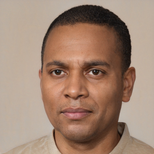 Neutral black young-adult male with short  black hair and brown eyes