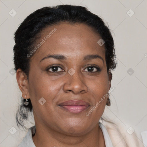 Joyful black adult female with short  brown hair and brown eyes