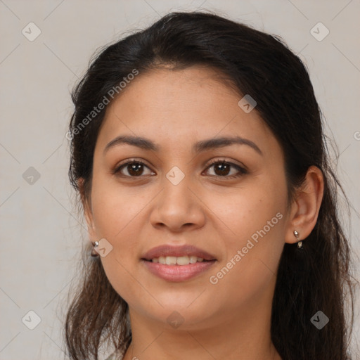 Joyful latino young-adult female with long  brown hair and brown eyes