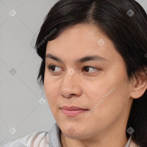 Joyful white young-adult female with medium  black hair and brown eyes