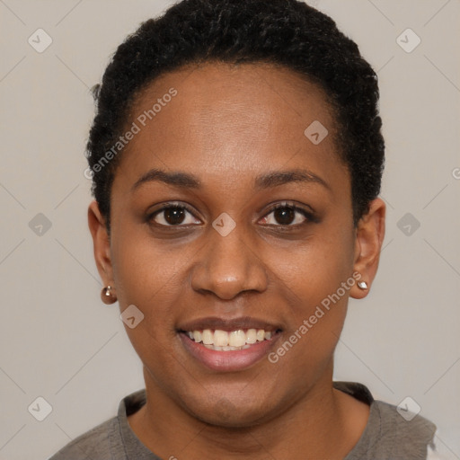 Joyful black young-adult female with short  black hair and brown eyes