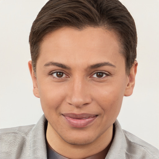 Joyful white young-adult female with short  brown hair and brown eyes