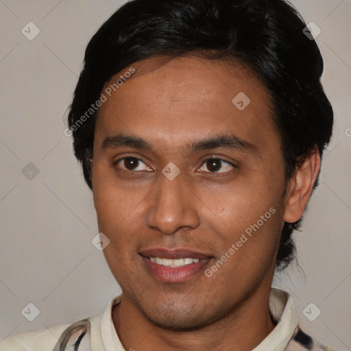 Joyful latino young-adult male with short  black hair and brown eyes