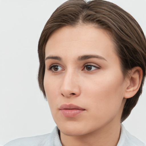 Neutral white young-adult female with short  brown hair and brown eyes