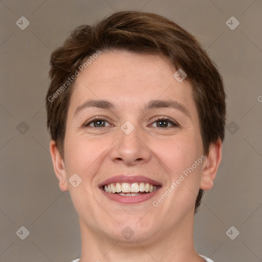 Joyful white young-adult female with short  brown hair and grey eyes