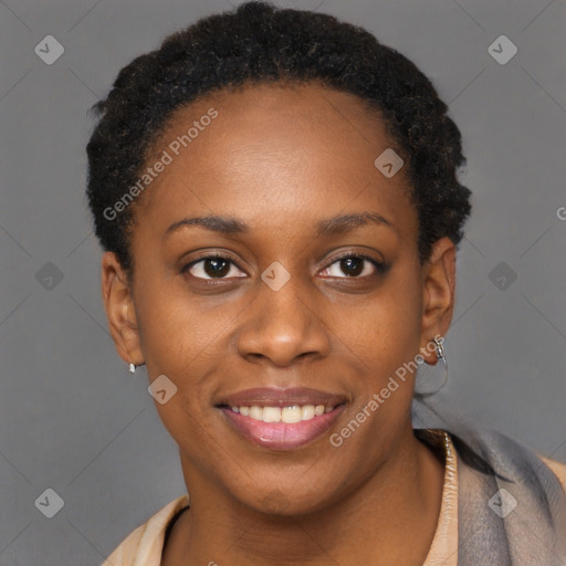 Joyful black young-adult female with short  brown hair and brown eyes