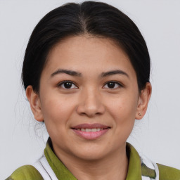 Joyful asian young-adult female with medium  brown hair and brown eyes