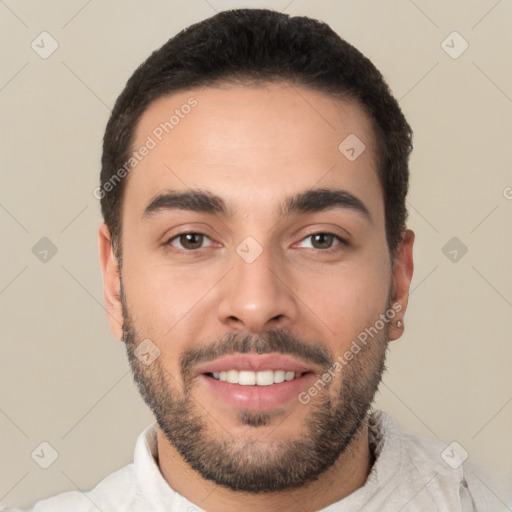 Joyful white young-adult male with short  black hair and brown eyes