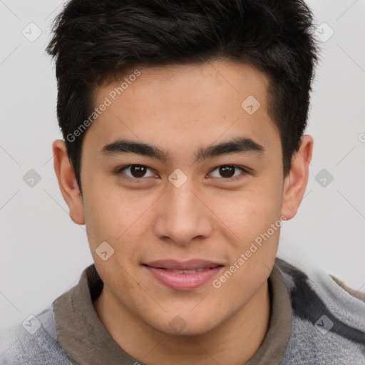 Joyful asian young-adult male with short  brown hair and brown eyes