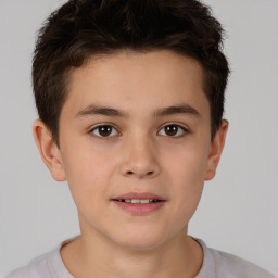 Joyful white child male with short  brown hair and brown eyes