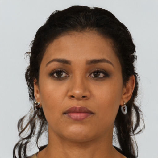 Neutral latino young-adult female with long  brown hair and brown eyes