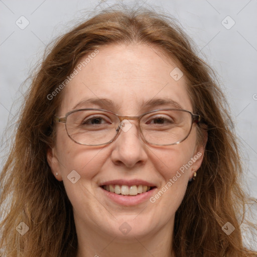 Joyful white adult female with long  brown hair and brown eyes