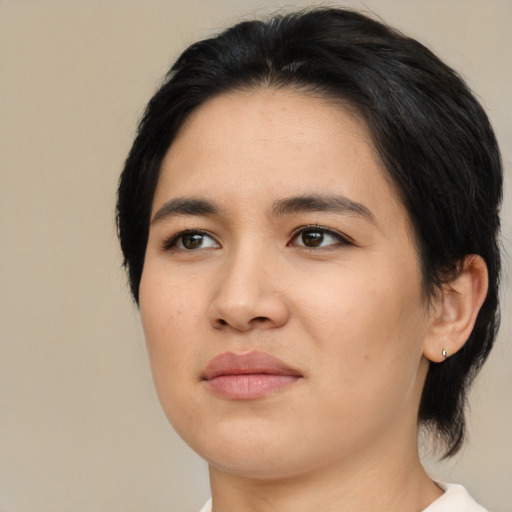 Joyful asian young-adult female with medium  black hair and brown eyes