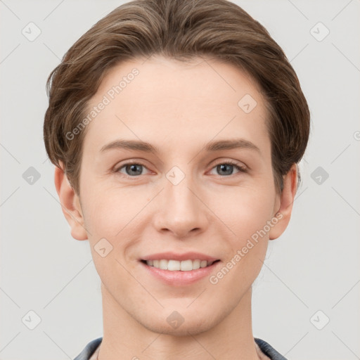 Joyful white young-adult female with short  brown hair and grey eyes