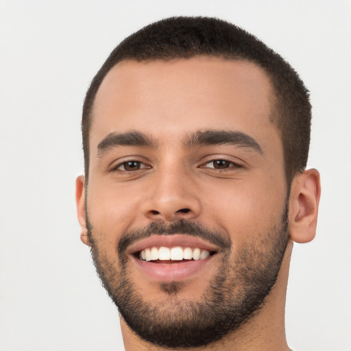 Joyful white young-adult male with short  black hair and brown eyes