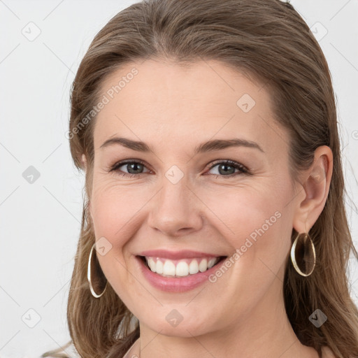 Joyful white young-adult female with long  brown hair and grey eyes