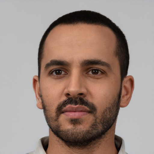 Neutral latino young-adult male with short  black hair and brown eyes