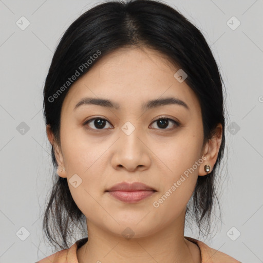 Joyful asian young-adult female with medium  black hair and brown eyes