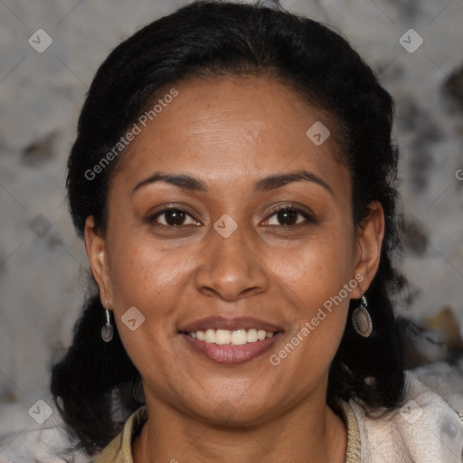 Joyful black adult female with short  brown hair and brown eyes