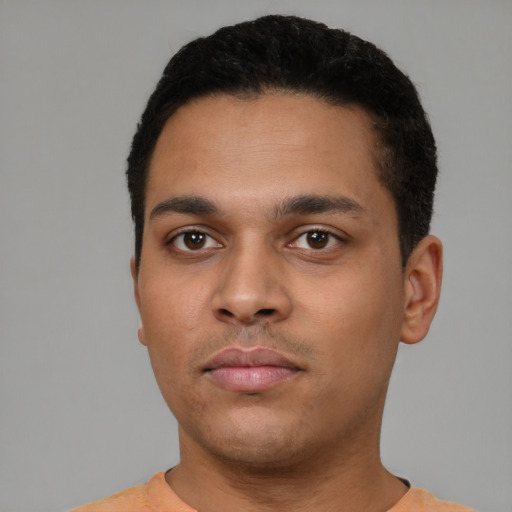 Neutral latino young-adult male with short  black hair and brown eyes