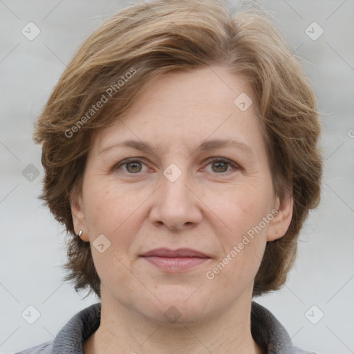 Joyful white adult female with medium  brown hair and grey eyes