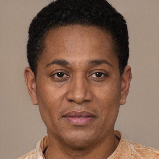 Joyful latino adult male with short  black hair and brown eyes
