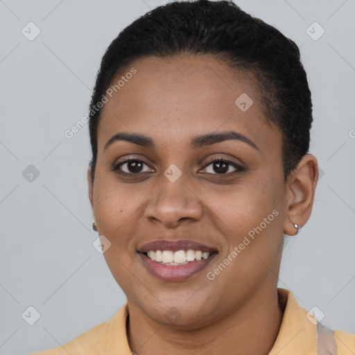 Joyful black young-adult female with short  brown hair and brown eyes