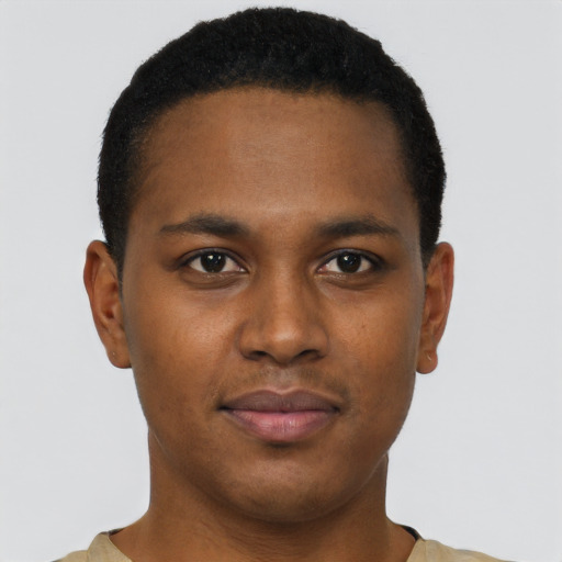 Joyful black young-adult male with short  brown hair and brown eyes