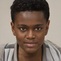 Joyful black young-adult male with short  brown hair and brown eyes