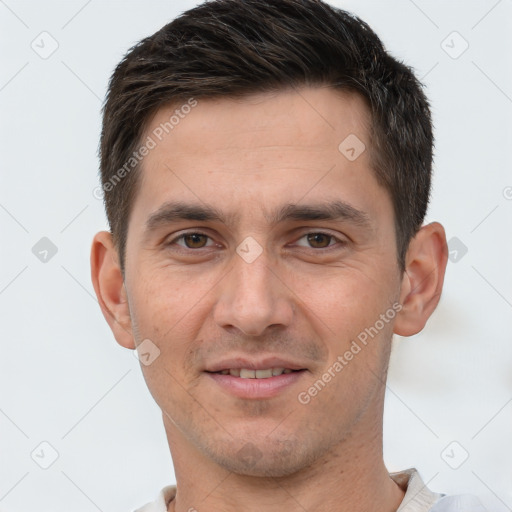 Joyful white young-adult male with short  brown hair and brown eyes