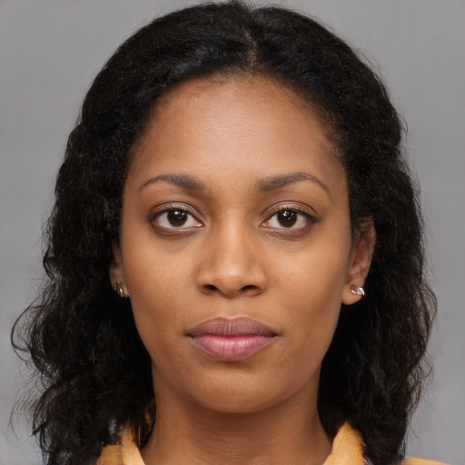 Neutral black young-adult female with long  brown hair and brown eyes