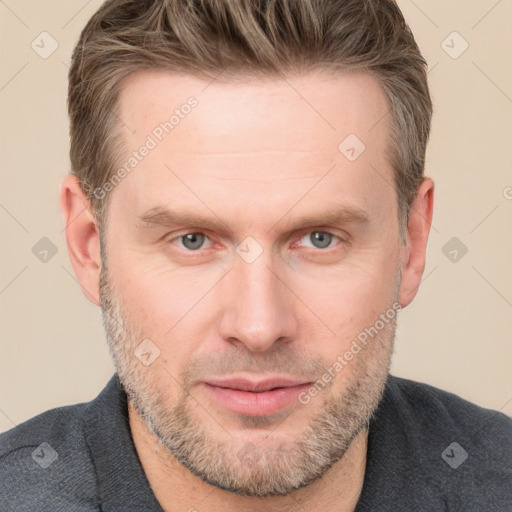 Joyful white adult male with short  brown hair and grey eyes