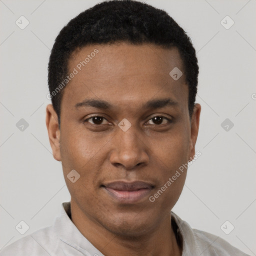 Joyful black young-adult male with short  black hair and brown eyes