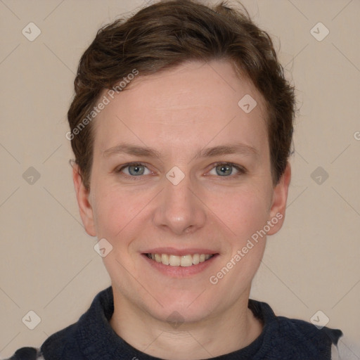 Joyful white young-adult female with short  brown hair and grey eyes