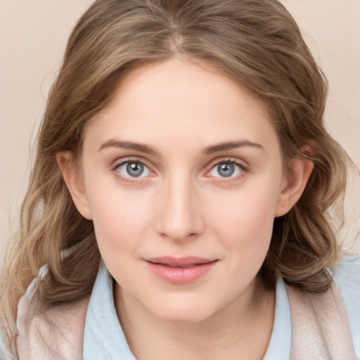 Joyful white young-adult female with medium  brown hair and blue eyes