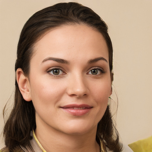 Joyful white young-adult female with medium  brown hair and brown eyes