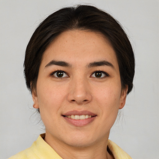 Joyful white young-adult female with medium  brown hair and brown eyes