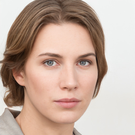 Neutral white young-adult female with medium  brown hair and grey eyes