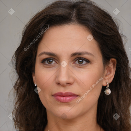 Joyful white adult female with long  brown hair and brown eyes