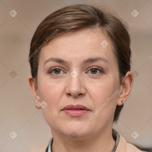 Joyful white adult female with short  brown hair and grey eyes