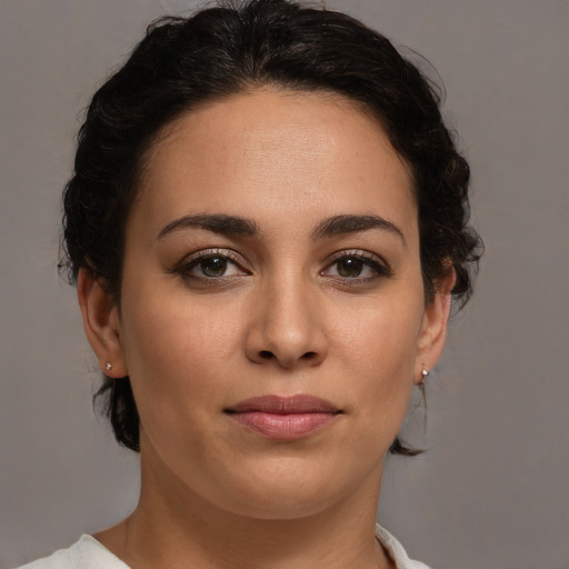 Joyful white young-adult female with medium  brown hair and brown eyes