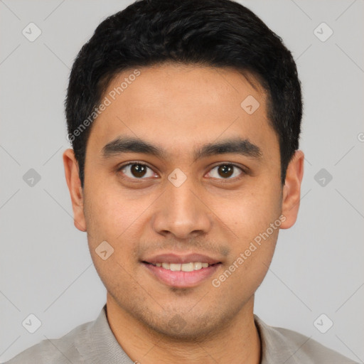 Joyful latino young-adult male with short  black hair and brown eyes