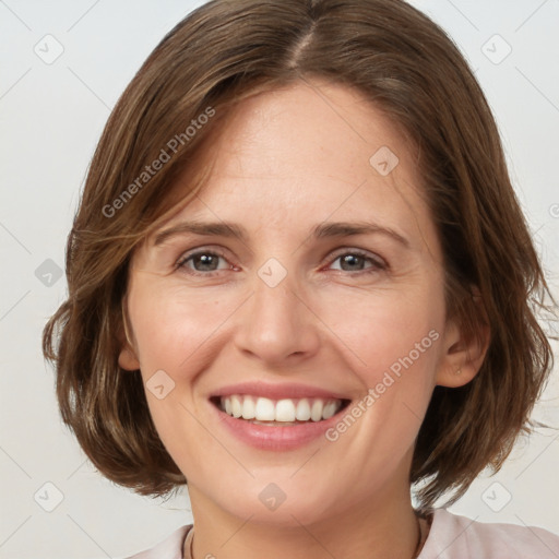 Joyful white adult female with medium  brown hair and grey eyes