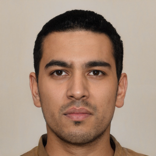 Neutral latino young-adult male with short  black hair and brown eyes