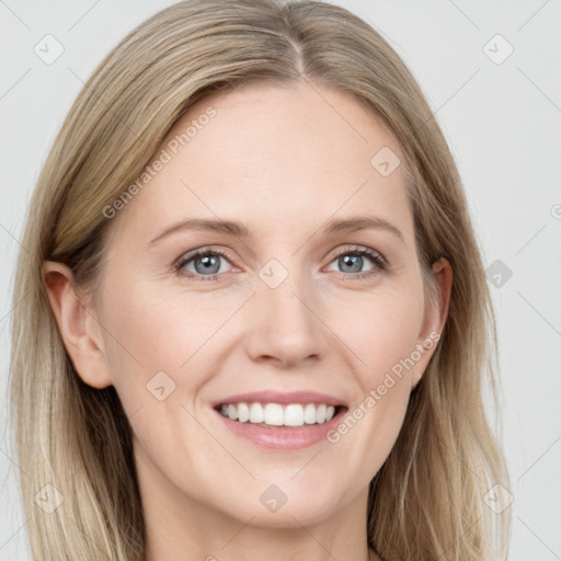 Joyful white young-adult female with long  brown hair and blue eyes