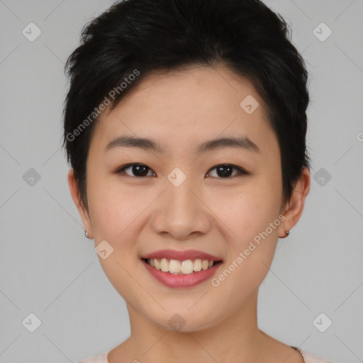 Joyful asian young-adult female with short  brown hair and brown eyes