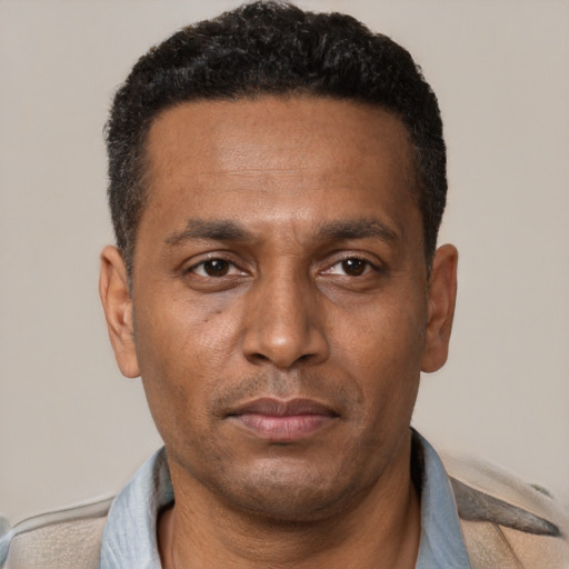 Neutral black adult male with short  brown hair and brown eyes
