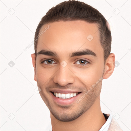 Joyful white young-adult male with short  black hair and brown eyes