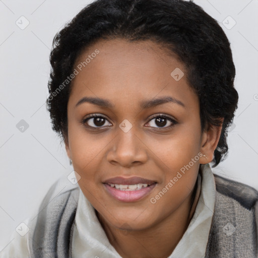 Joyful black young-adult female with short  black hair and brown eyes