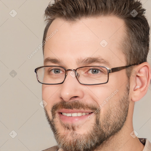 Joyful white adult male with short  brown hair and brown eyes